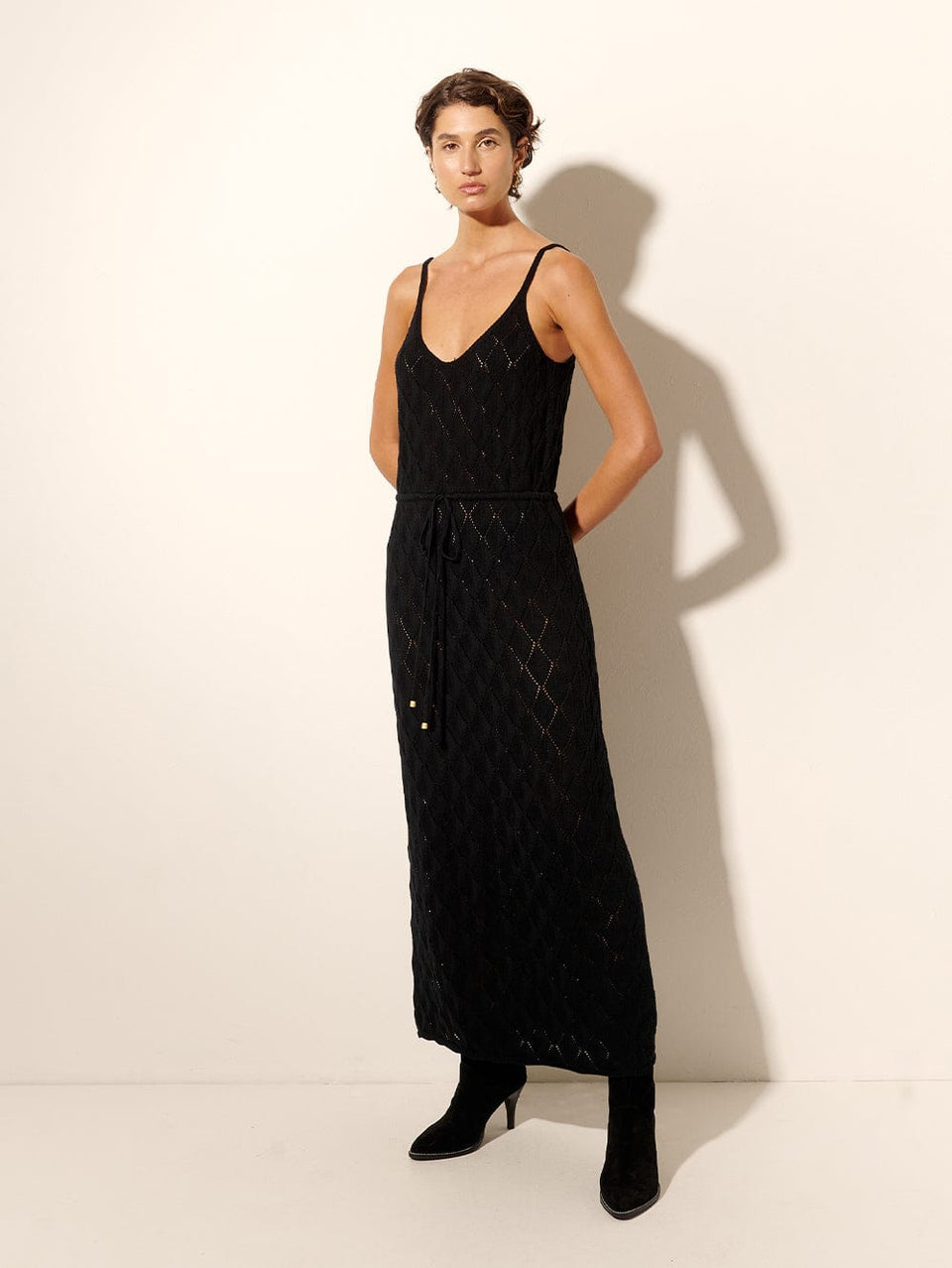 Claudia Strappy Midi Dress Black KIVARI | Model wears black knit midi dress side view