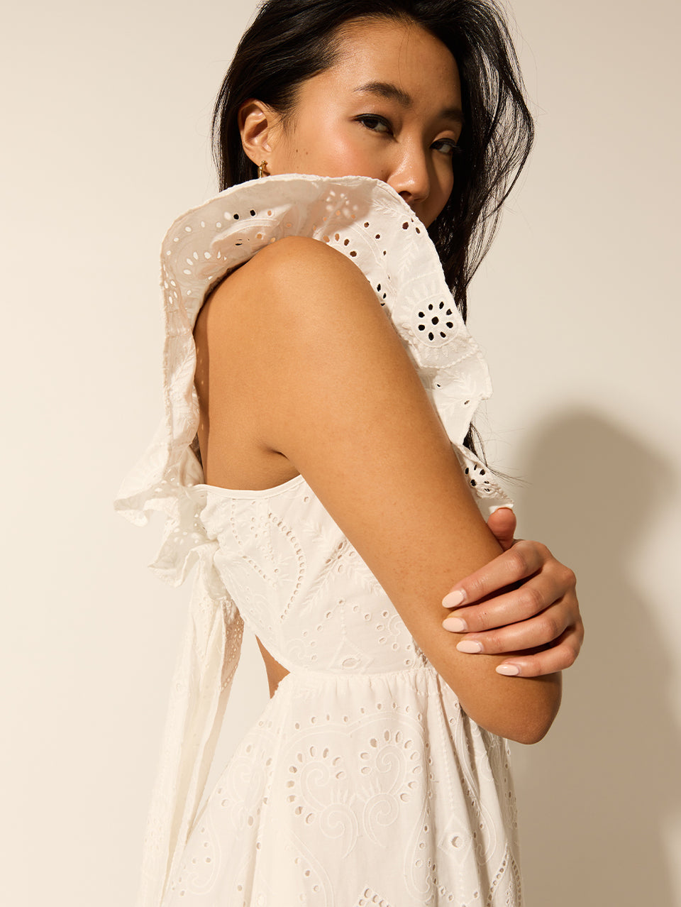 Clove Midi Dress KIVARI | Model wears white embroidered midi dress detail