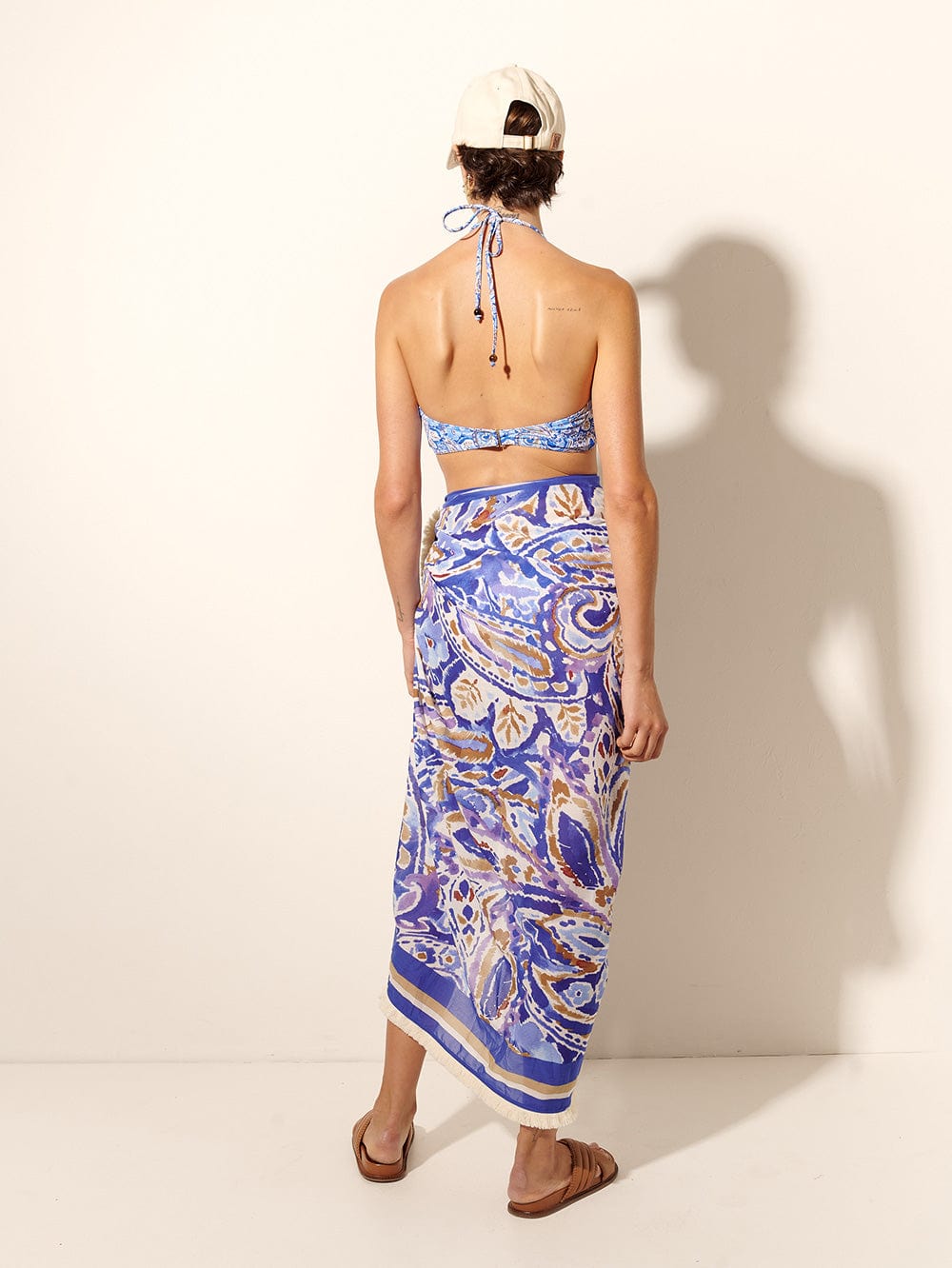 Dakota Pareo KIVARI | Model wears blue paisley sarong back view