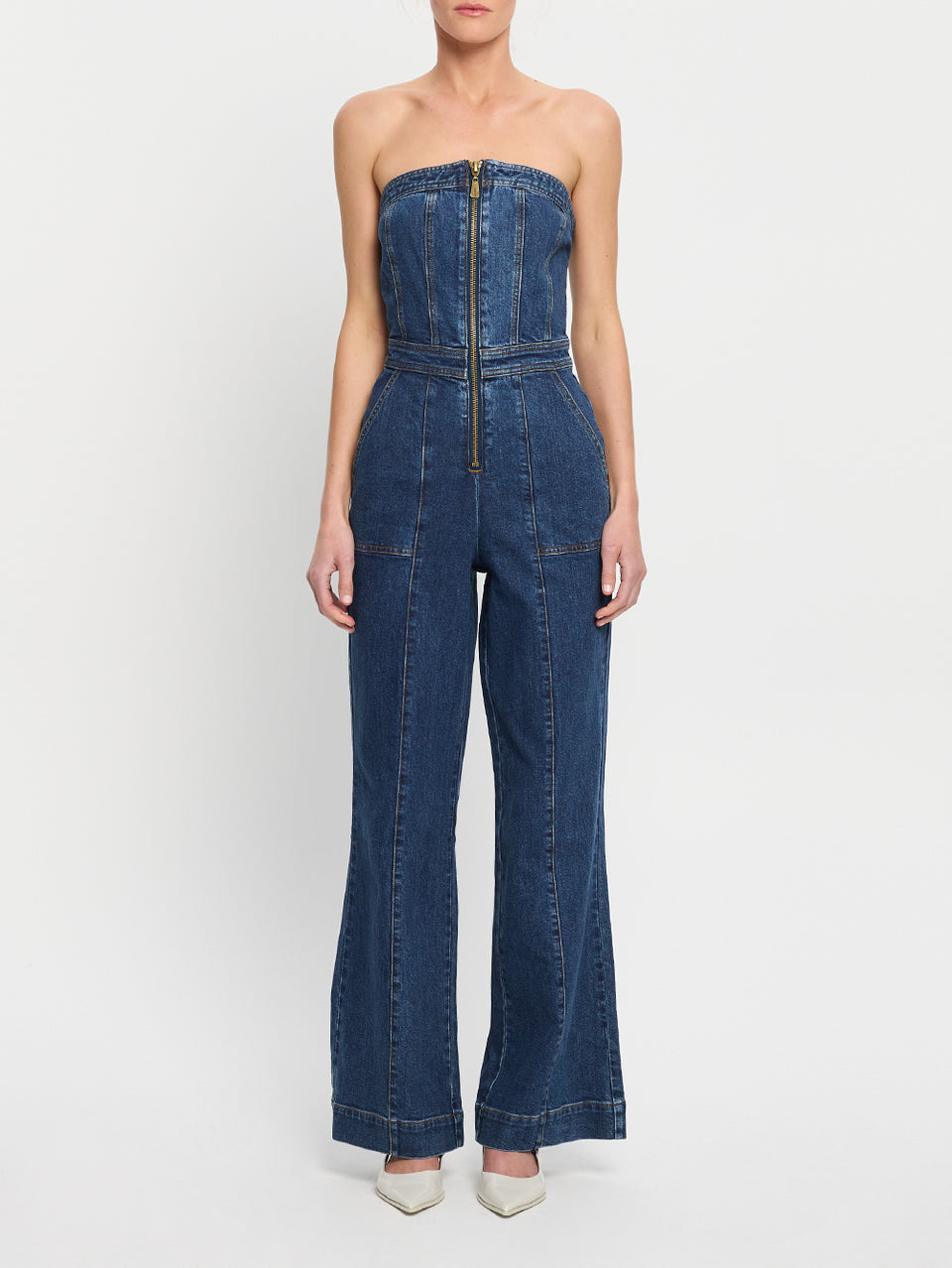 Dani Jumpsuit Indigo KIVARI | Model wears indigo blue denim strapless jumpsuit