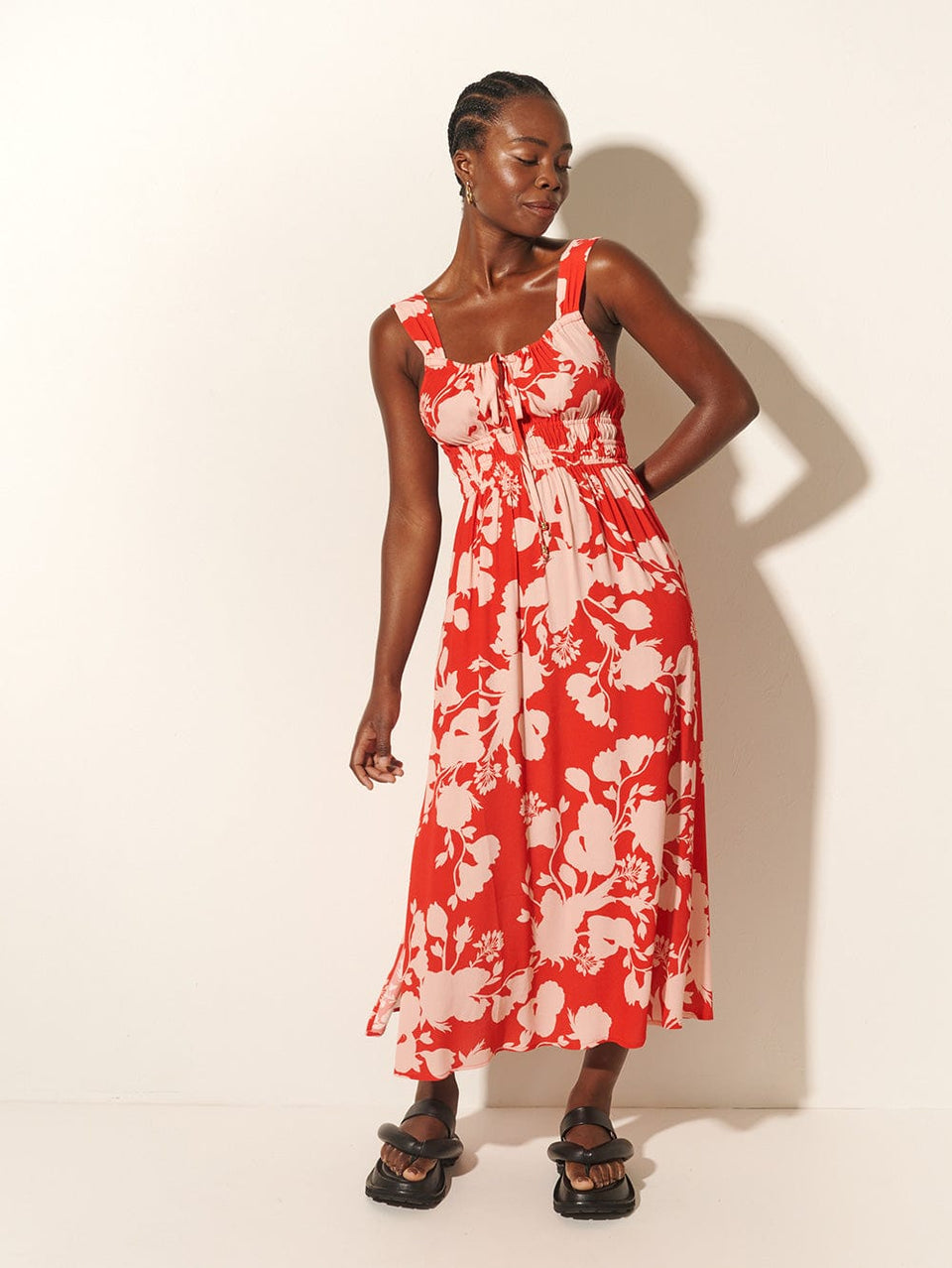 Delfina Midi Dress KIVARI | Model wears red and pink floral midi dress