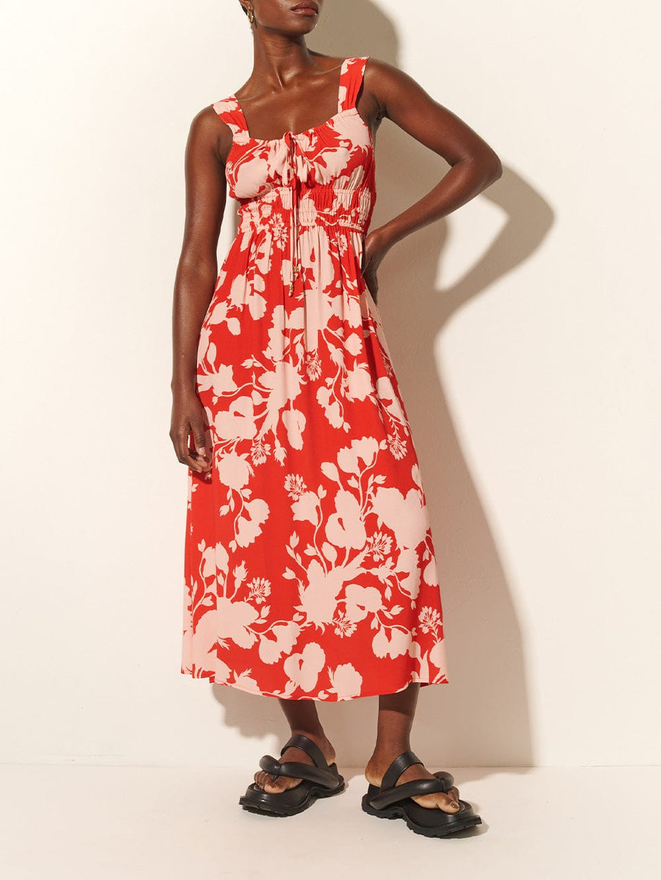 Delfina Midi Dress KIVARI | Model wears red and pink floral midi dress