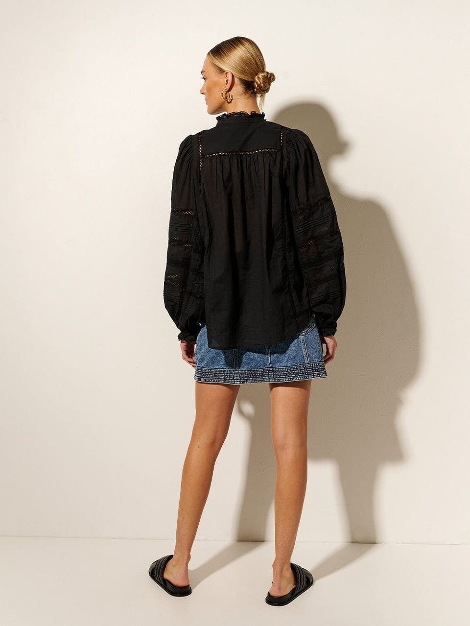KIVARI Delia Blouse | Model wears Black Blouse Back View