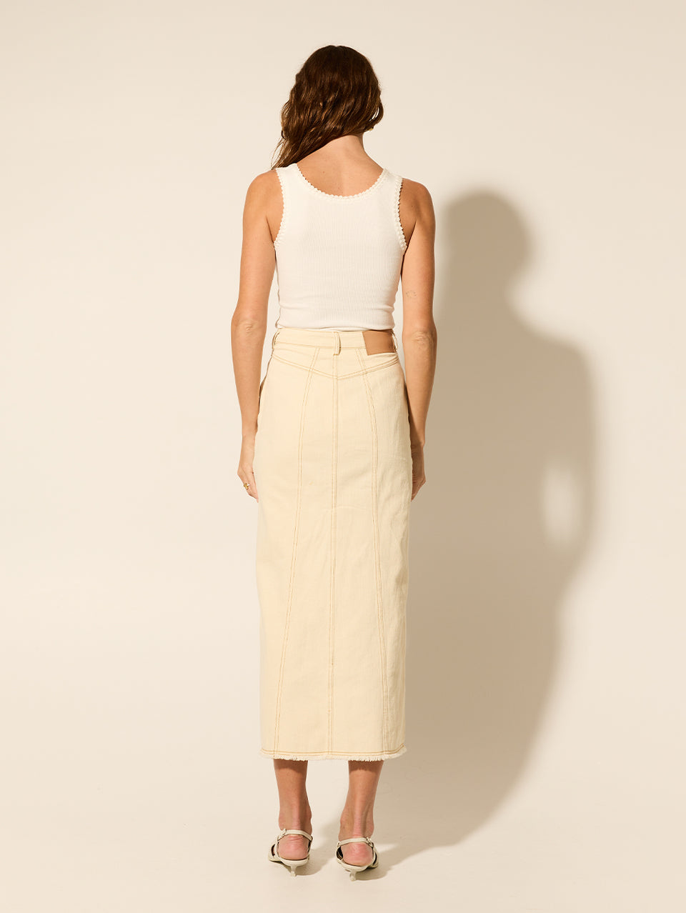 Elena Skirt Cream KIVARI | Model wears cream denim skirt back view