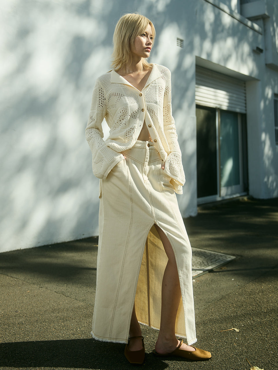 Elena Skirt Cream KIVARI | Model wears cream denim skirt campaign