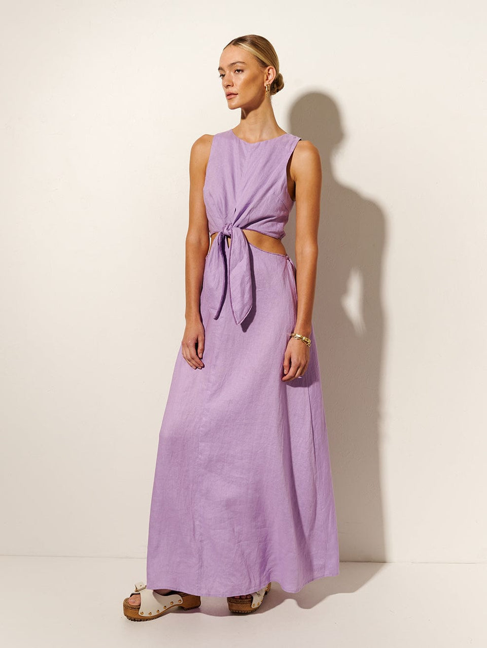 Ellie Cut Out Maxi Dress KIVARI | Model wears purple cut out maxi dress side view