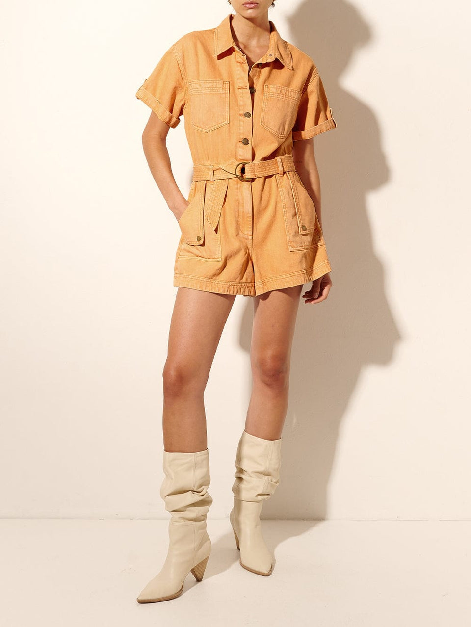 Georgie Playsuit Peach KIVARI | Model wears orange denim playsuit