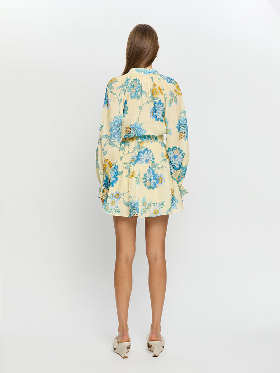 Giselle Blouson Mini Dress KIVARI | Model wears yellow and blue floral mini dress