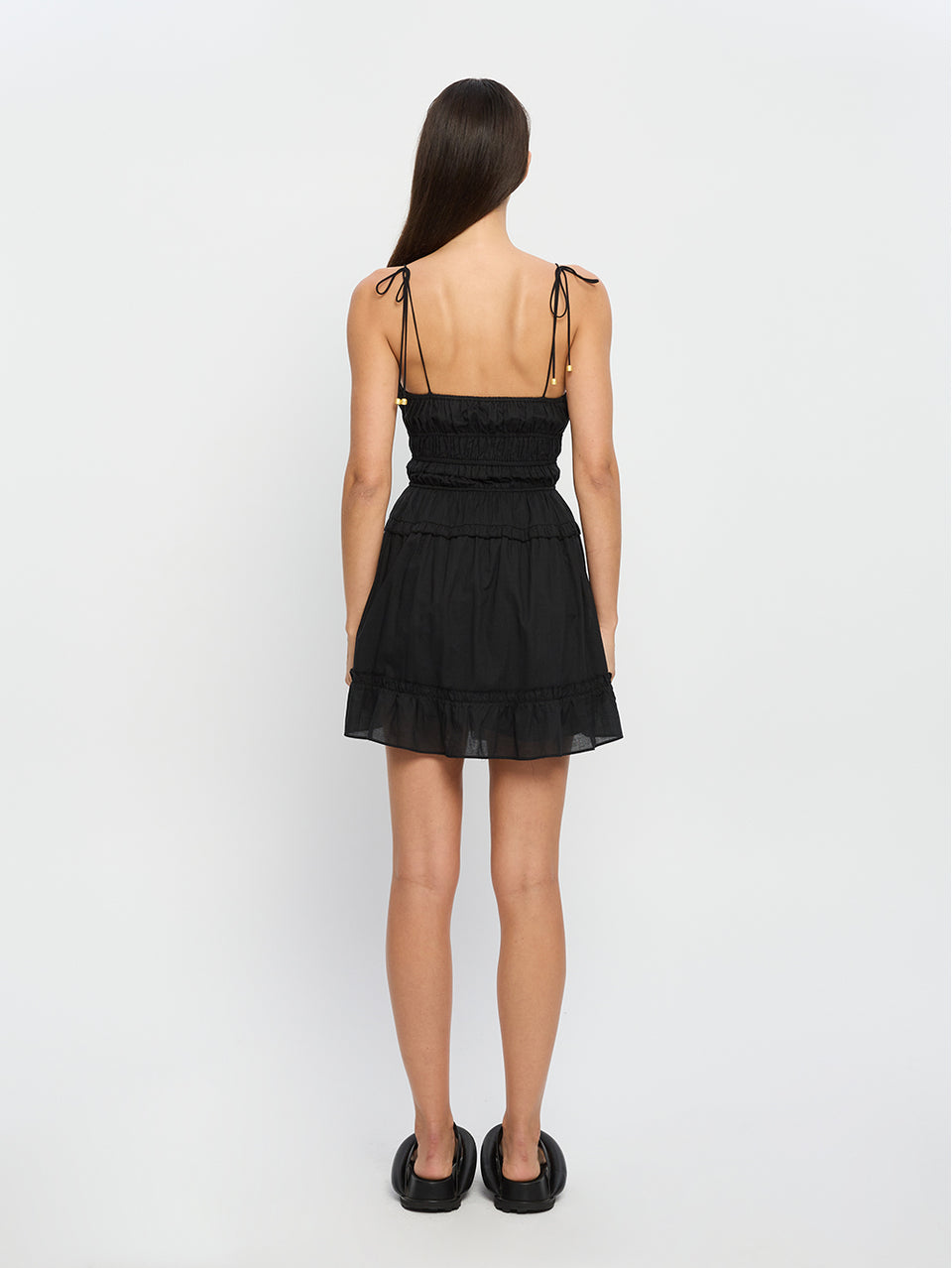 Hallie Mini Dress KIVARI | Model wears black mini dress back view