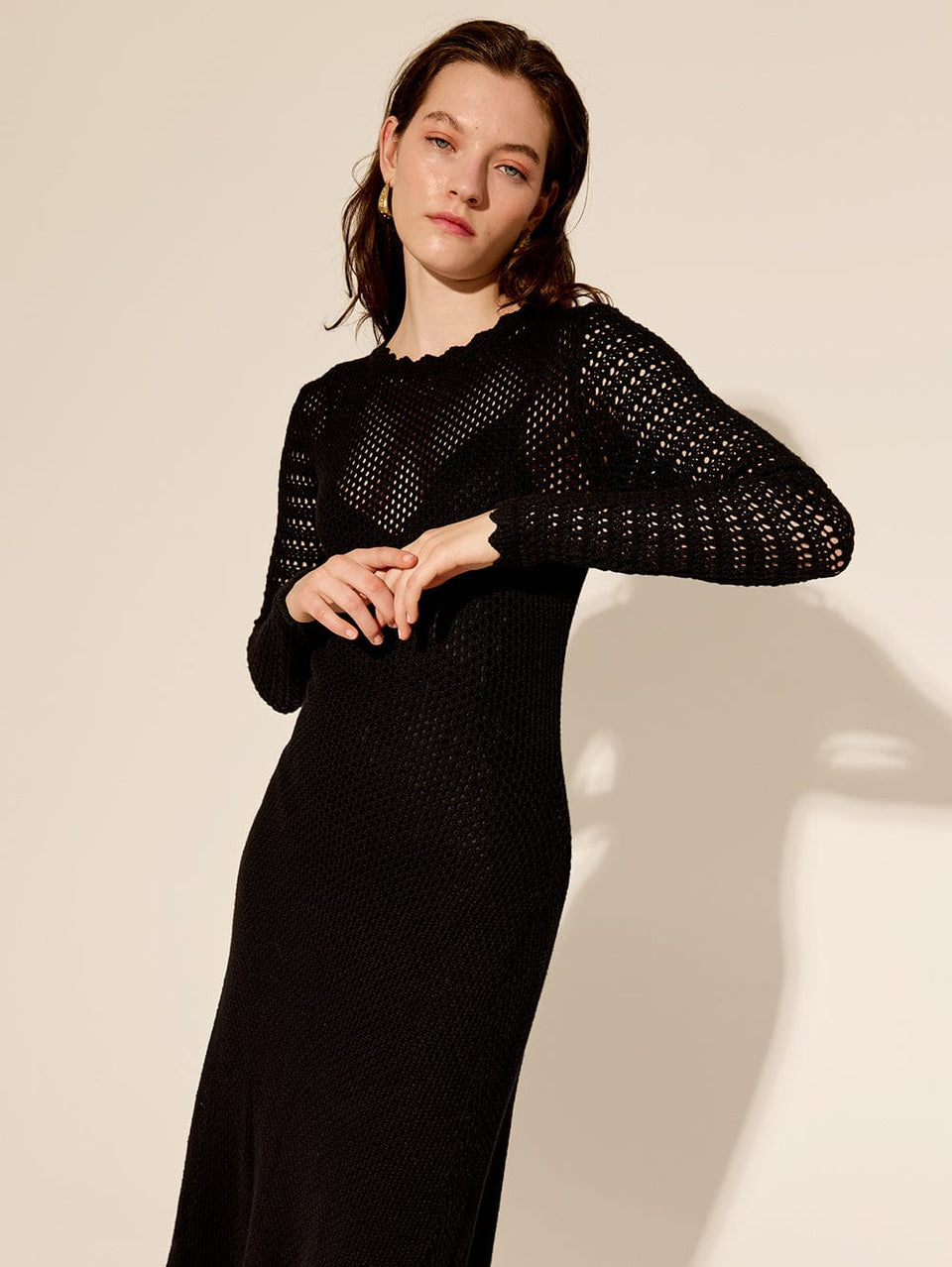 Ingrid Midi Dress Black KIVARI | Model wears black knit midi dress close up