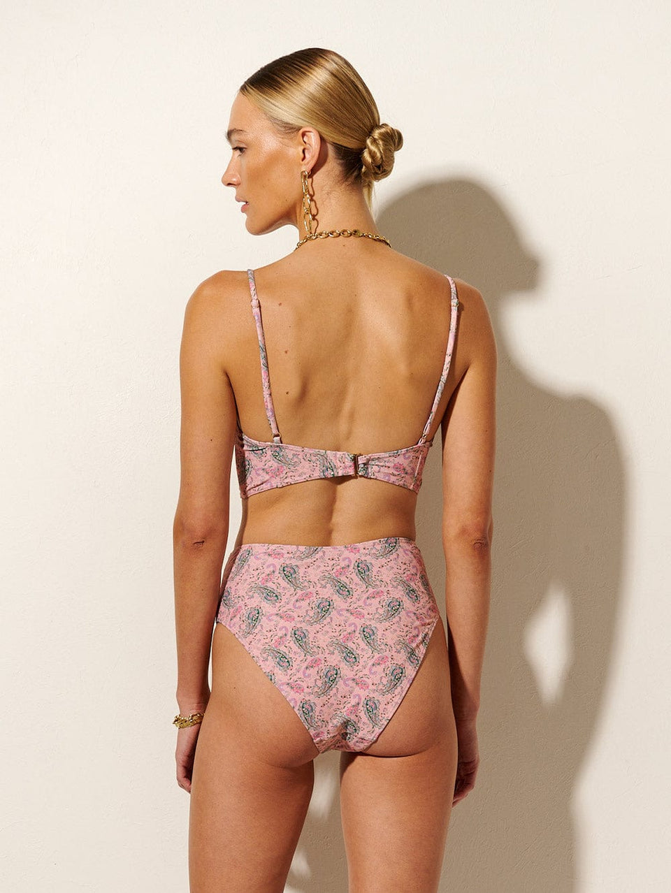 Isha High Waisted Bikini Bottom KIVARI | Model wears high waisted pink paisley bikini bottom back view