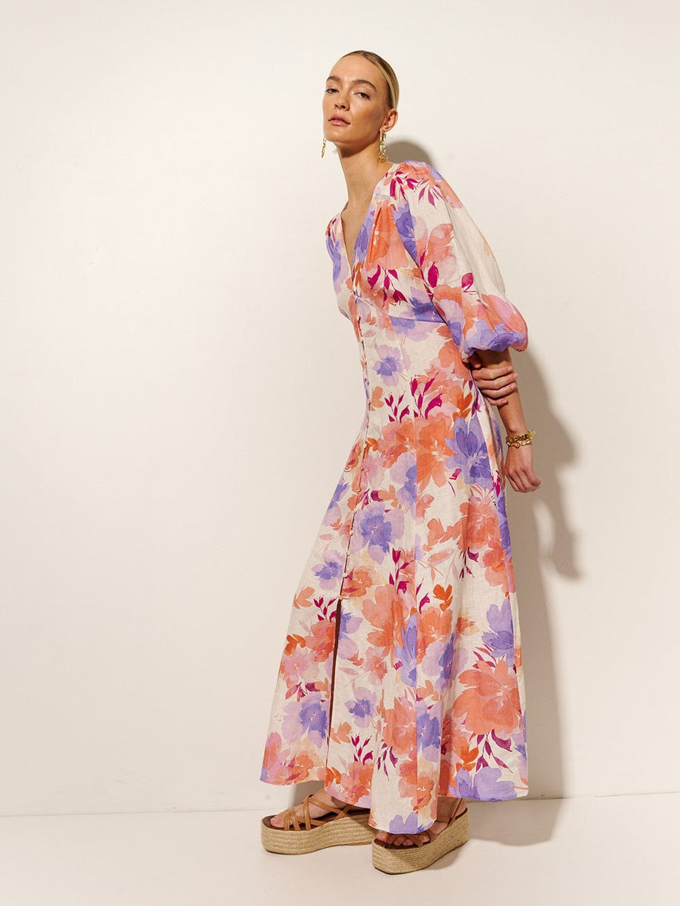 Johannes Maxi Dress KIVARI | Model wears pink and purple floral maxi dress side view