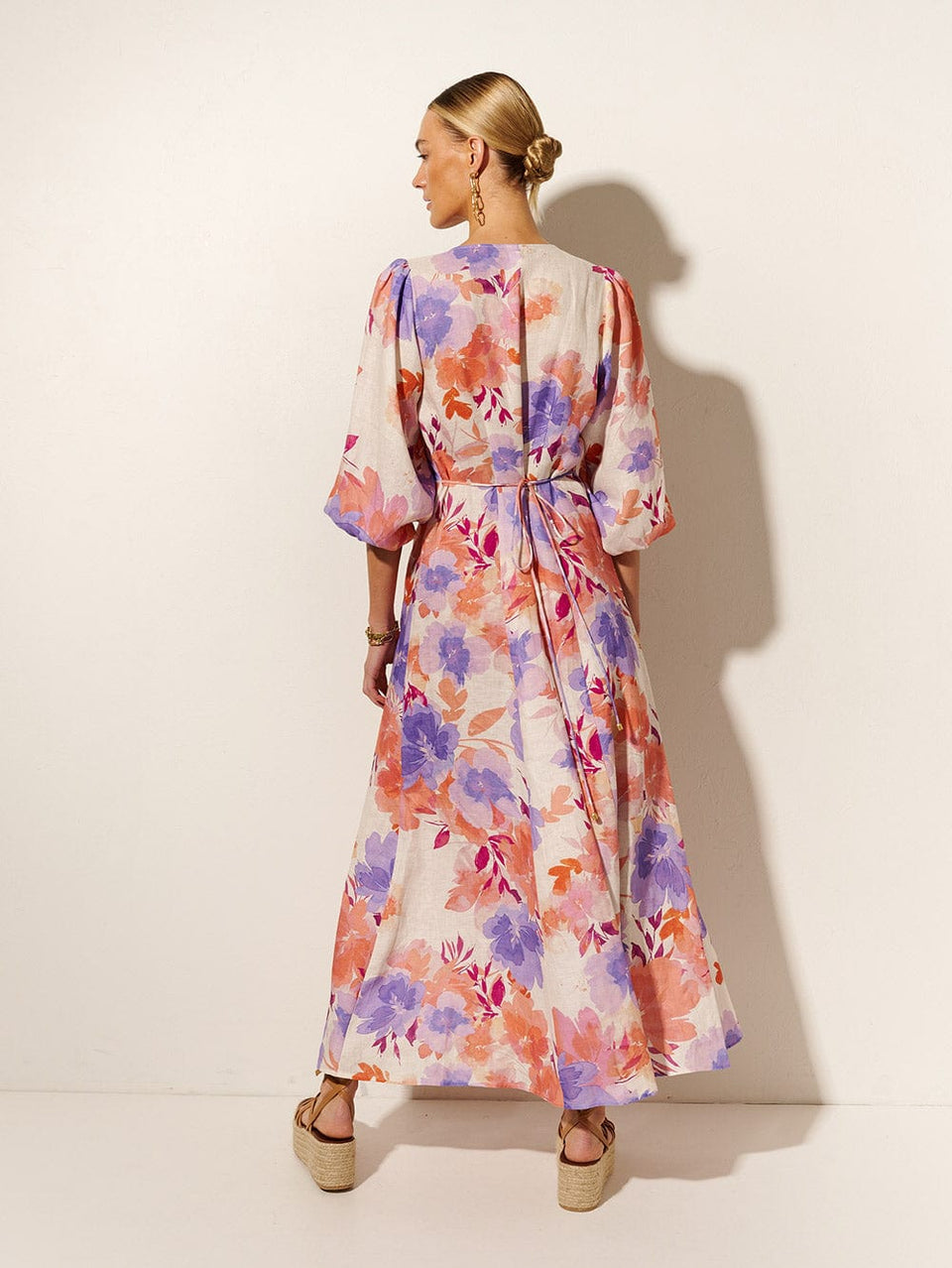 Johannes Maxi Dress KIVARI | Model wears pink and purple floral maxi dress back view