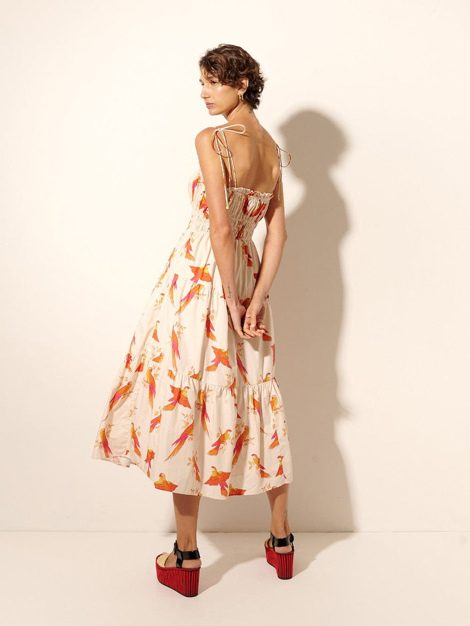 Kaylee Midi Dress KIVARI | Model wears pink and orange bird print midi dress back view
