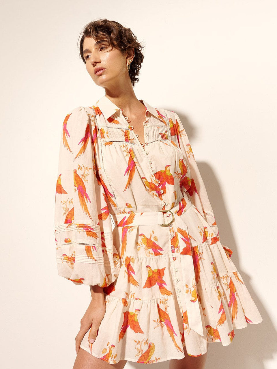 Kaylee Mini Dress KIVARI | Model wears pink and orange bird print mini dress close up