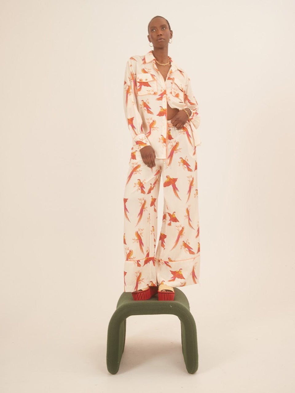 Kaylee Pant KIVARI | Model wears pink and orange bird printed pants campaign