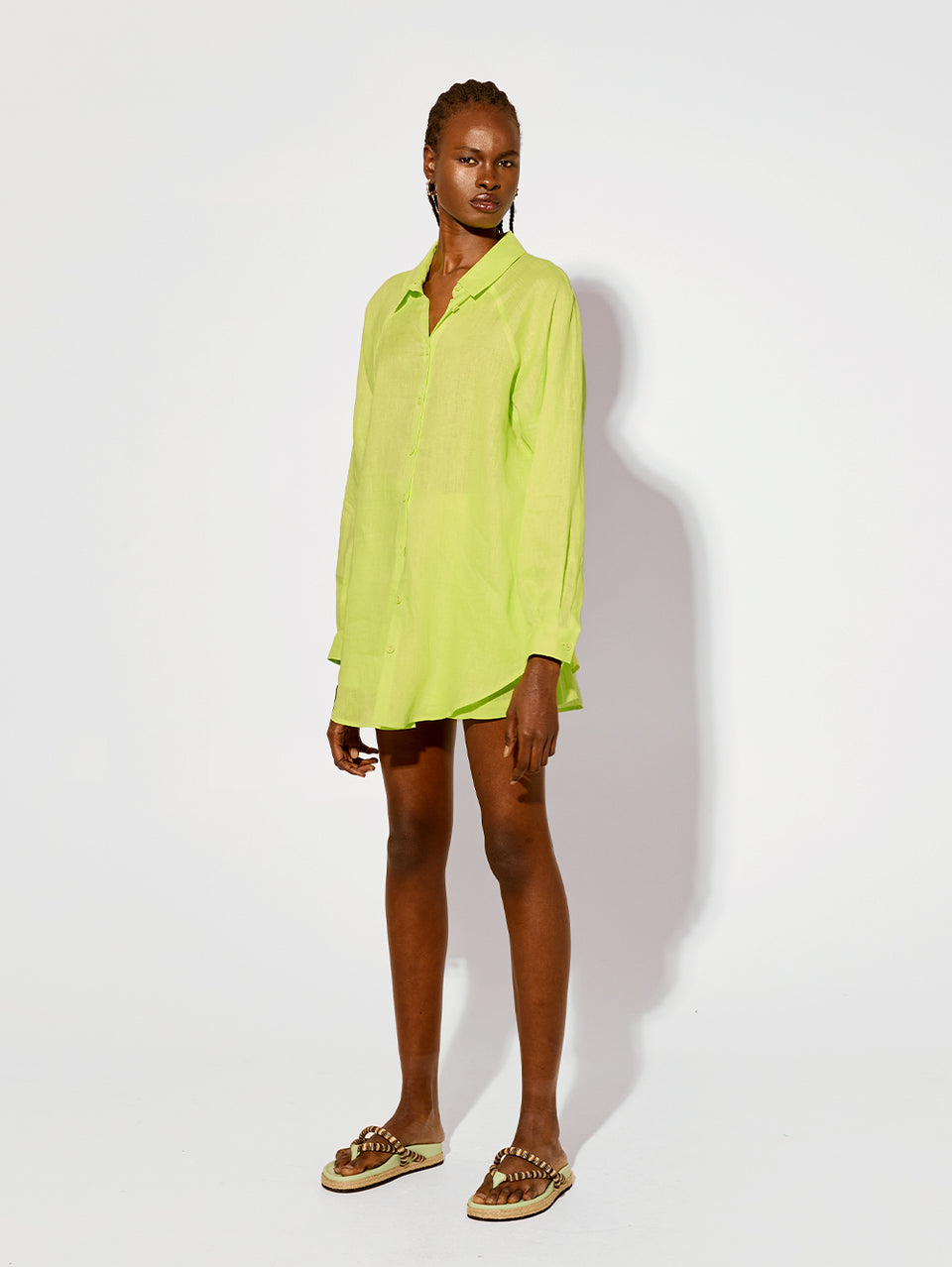 Leona Short Lime KIVARI | Model wears lime green linen shorts side view