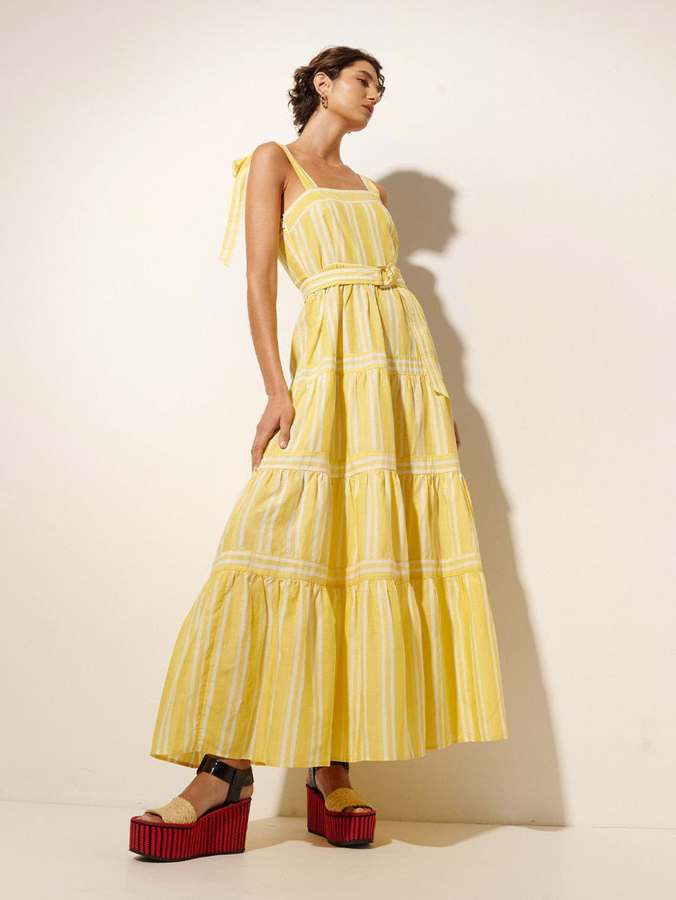 Lola Maxi Dress KIVARI | Model wears yellow and white striped maxi dress