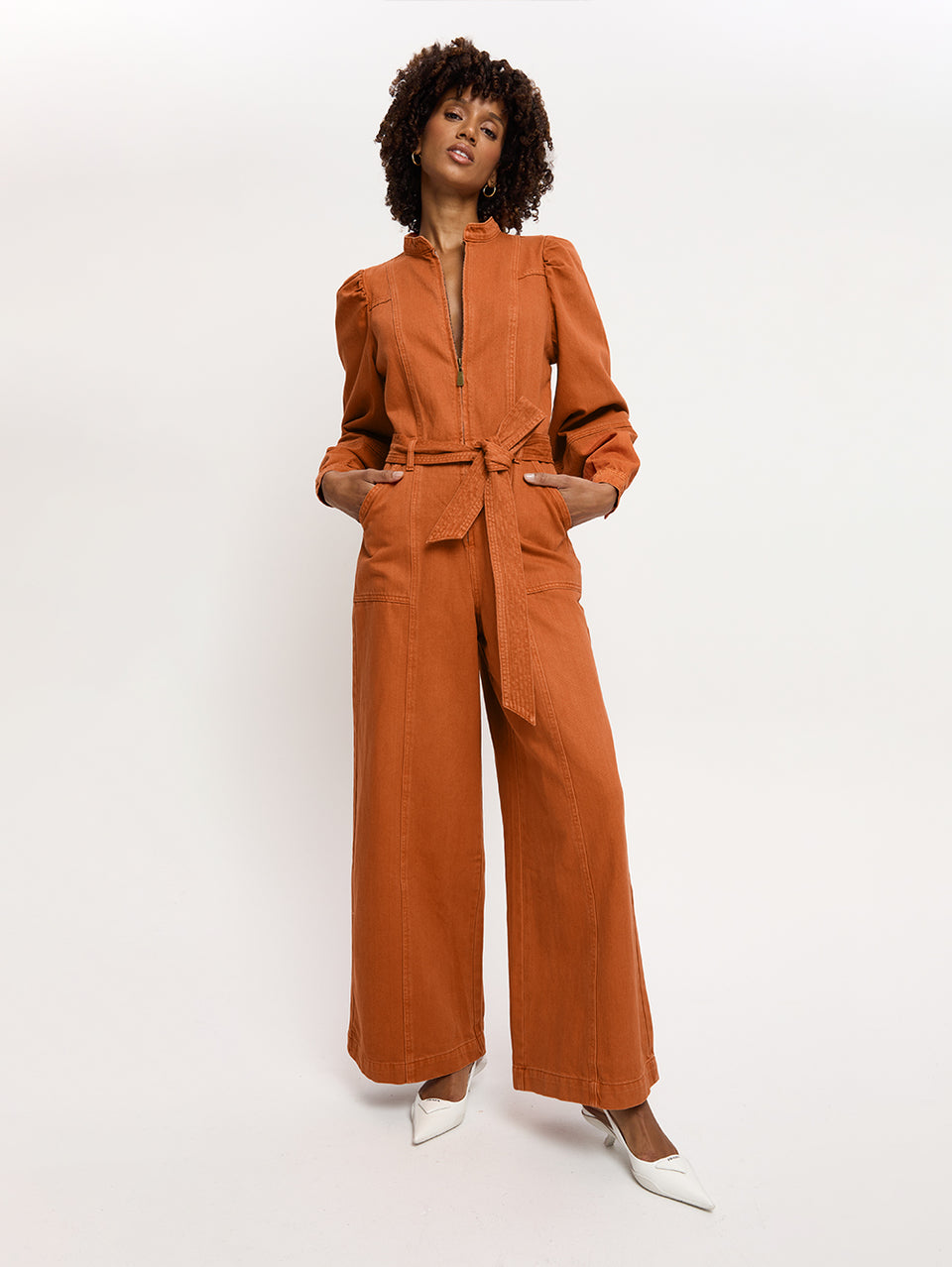 Lourdes Boilersuit Rust KIVARI | Model wears orange denim boilersuit