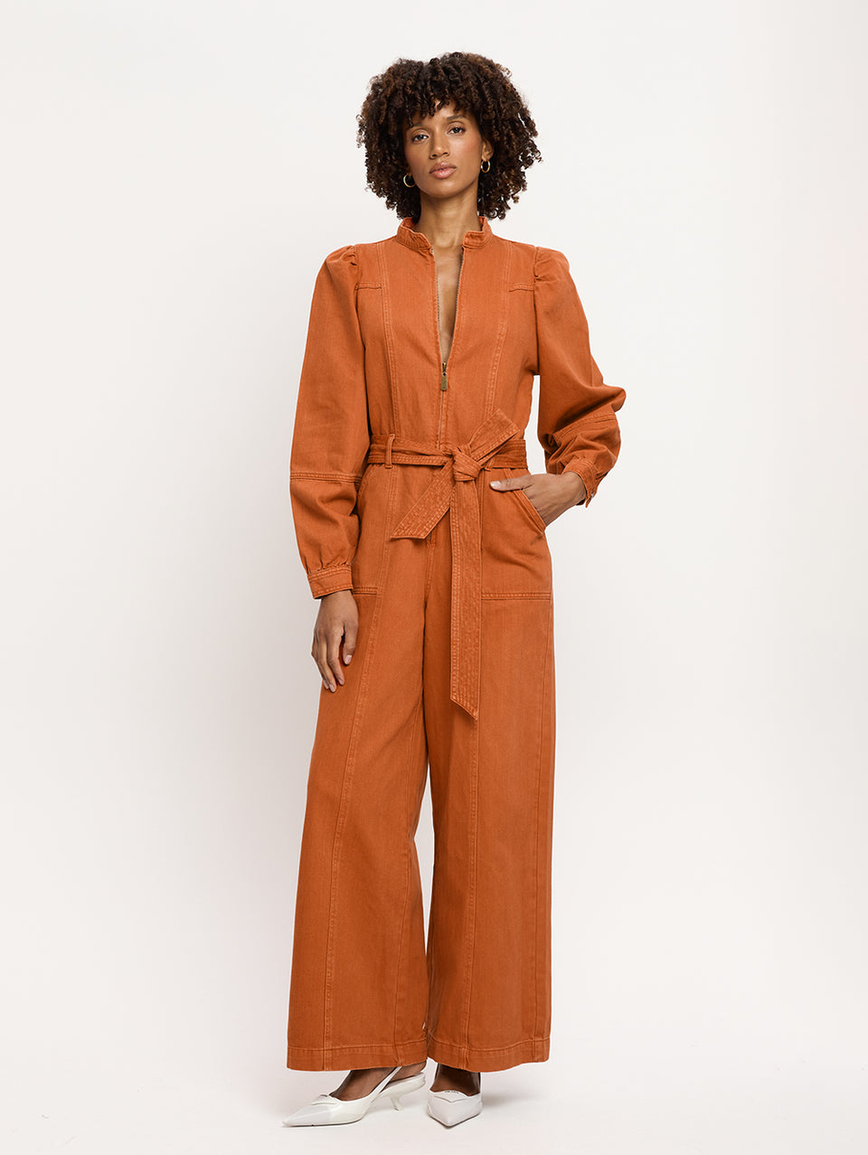 Lourdes Boilersuit Rust KIVARI | Model wears orange denim boilersuit