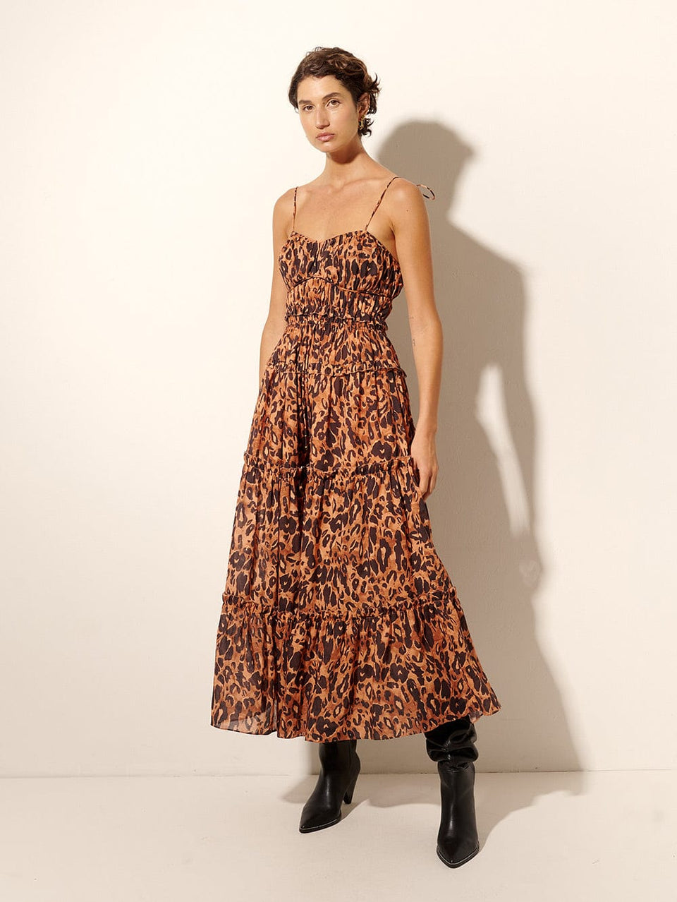 Madison Midi Dress KIVARI | Model wears orange and brown leopard midi dress side view