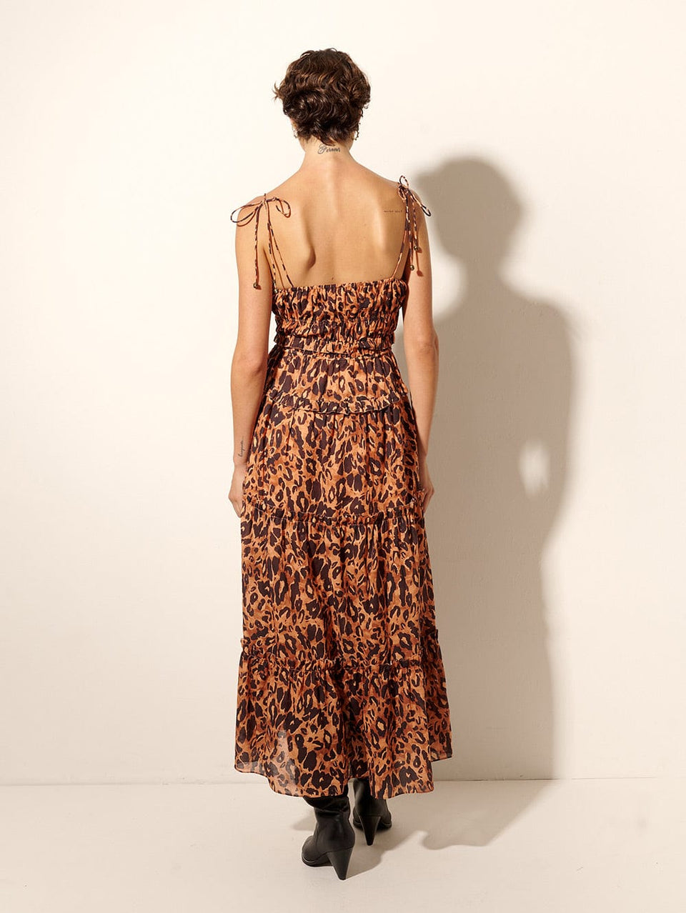 Madison Midi Dress KIVARI | Model wears orange and brown leopard midi dress back view