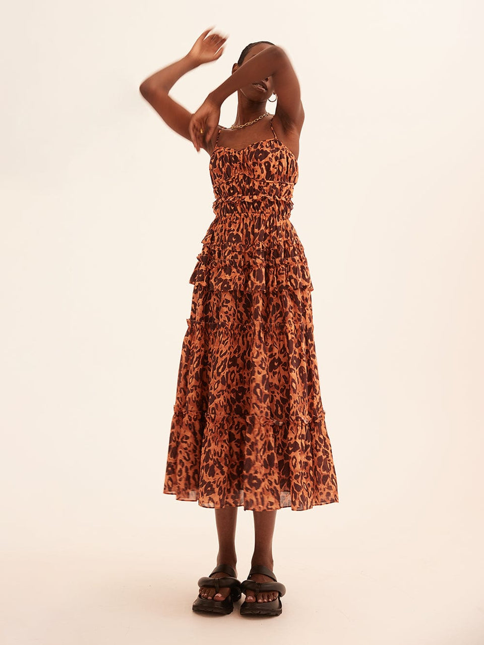 Madison Midi Dress KIVARI | Model wears orange and brown leopard midi dress campaign