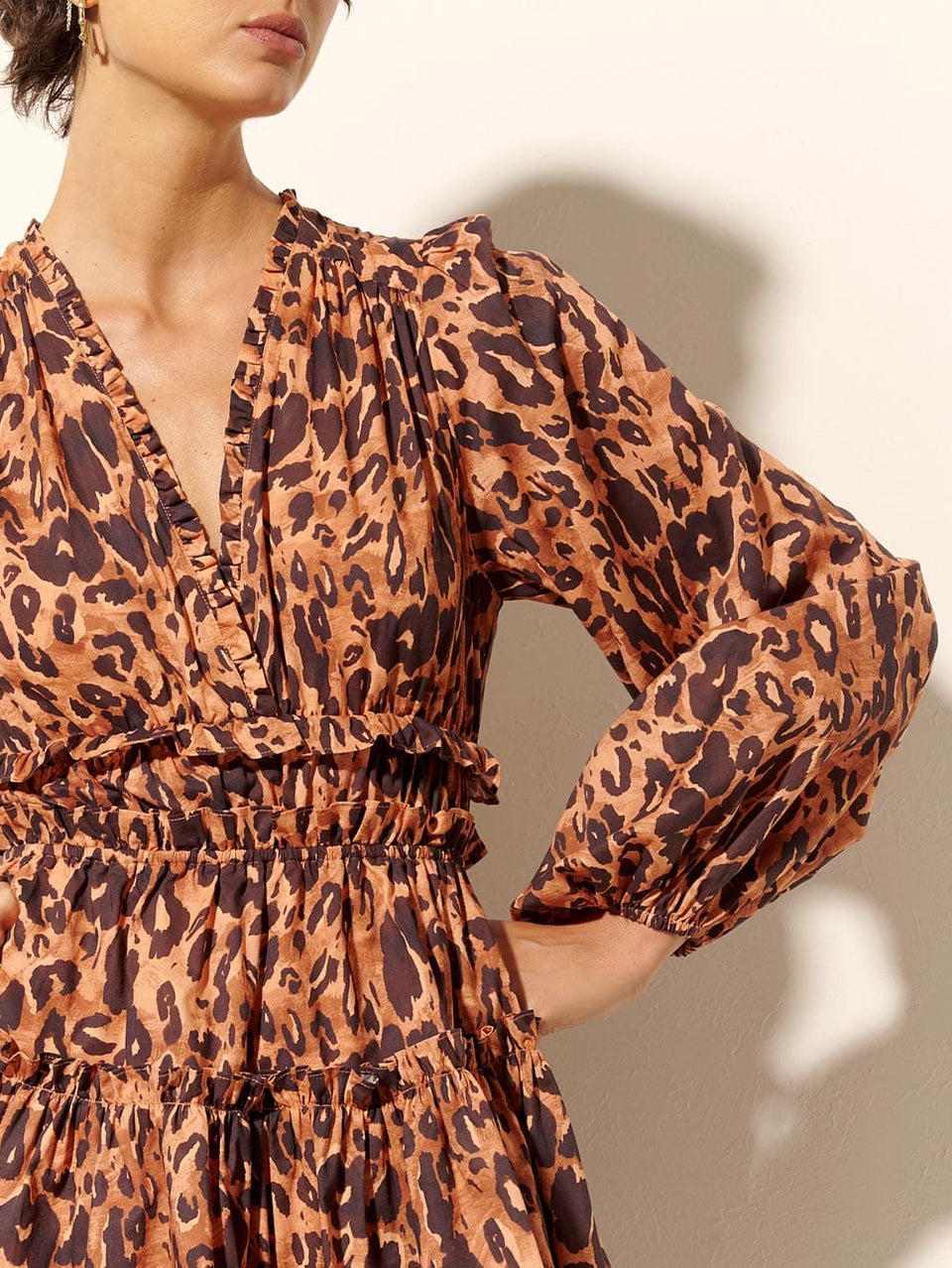 Madison Mini Dress KIVARI | Model wears orange and brown leopard mini dress detail shot