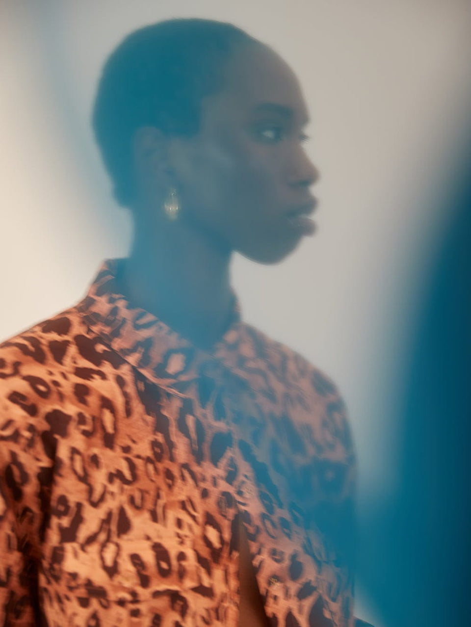 Madison Shirt KIVARI | Model wears orange and brown leopard shirt campaign