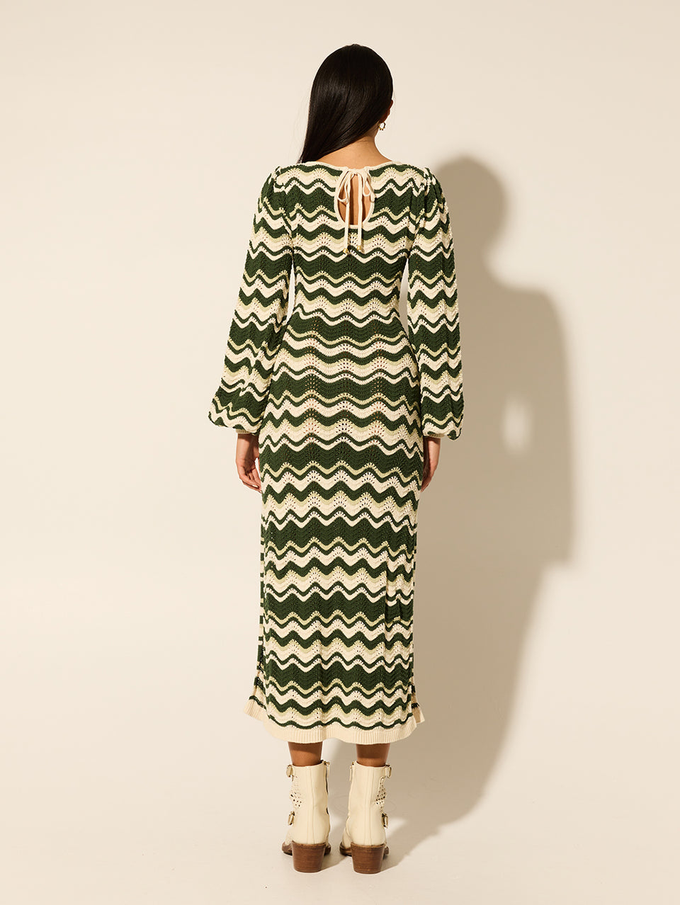 Marcella Knit Midi Dress KIVARI | Model wears green and cream midi dress back view