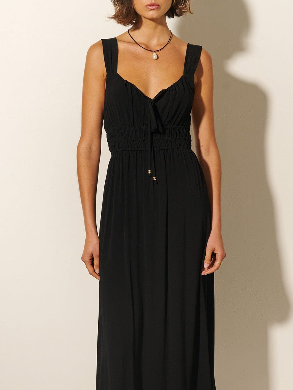 Maria Strappy Midi Dress KIVARI | Model wears black midi dress close up