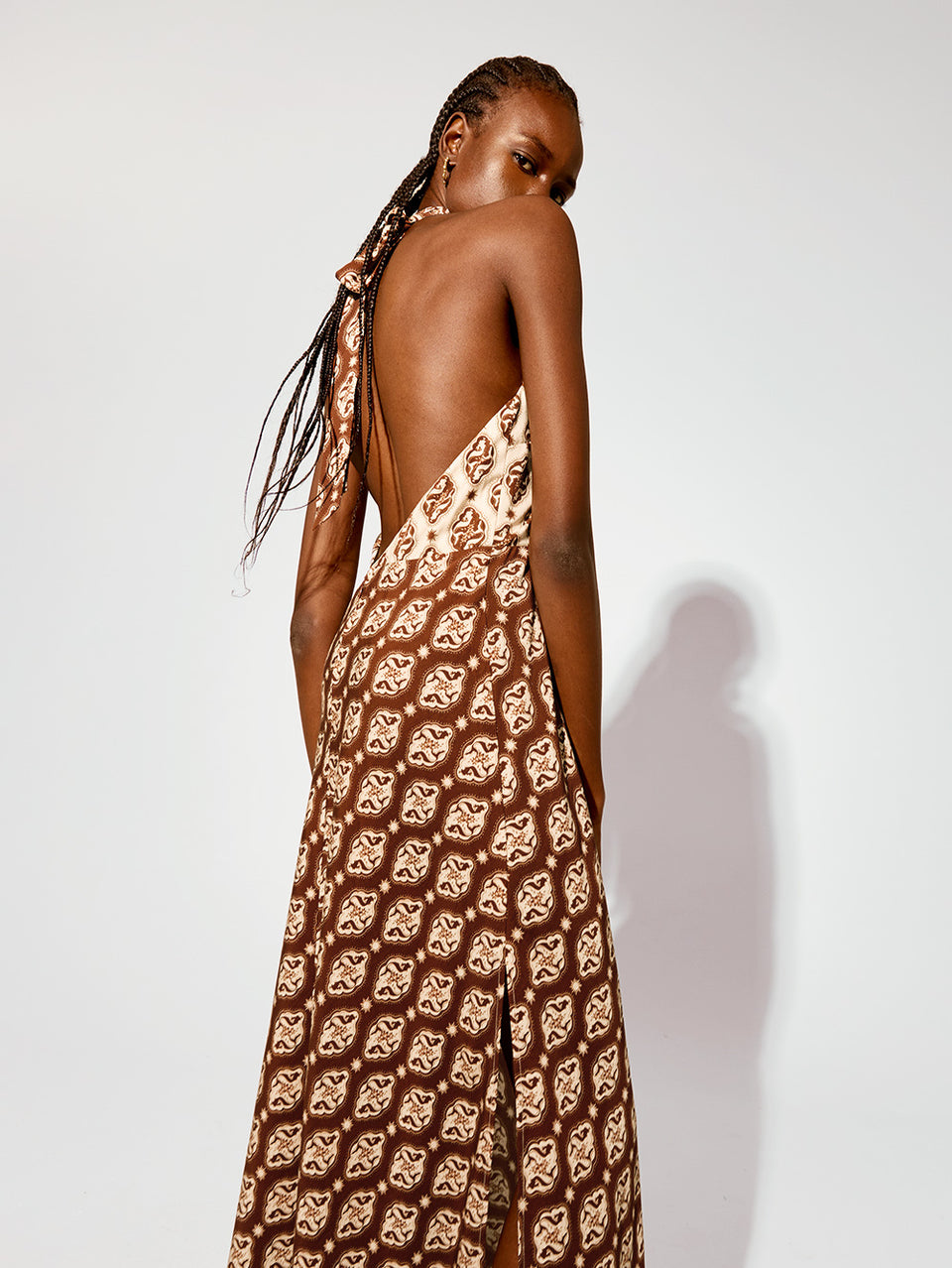 Melody Maxi Dress KIVARI | Model wears brown and cream print halter dress