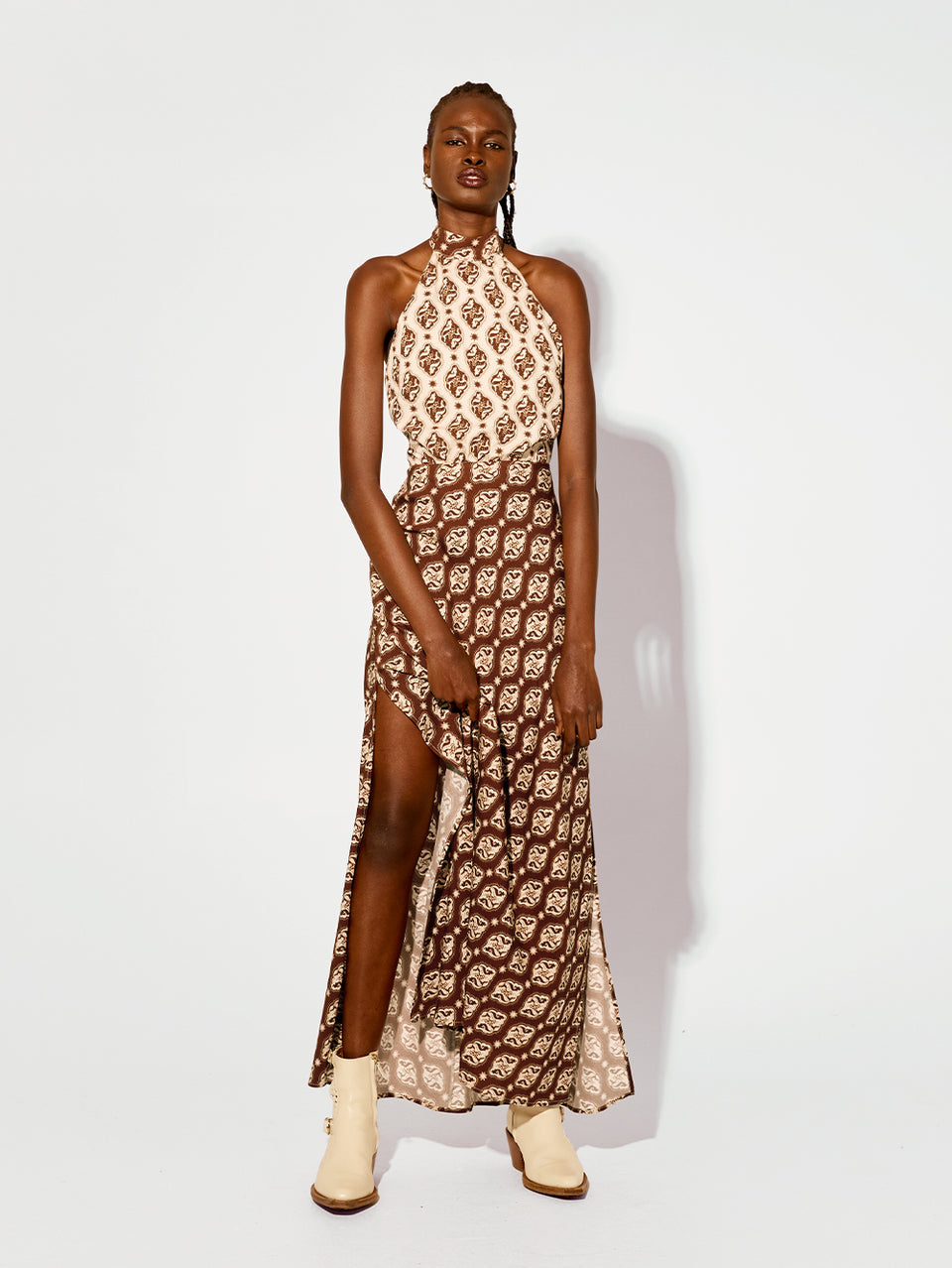 Melody Maxi Dress KIVARI | Model wears brown and cream print halter dress 