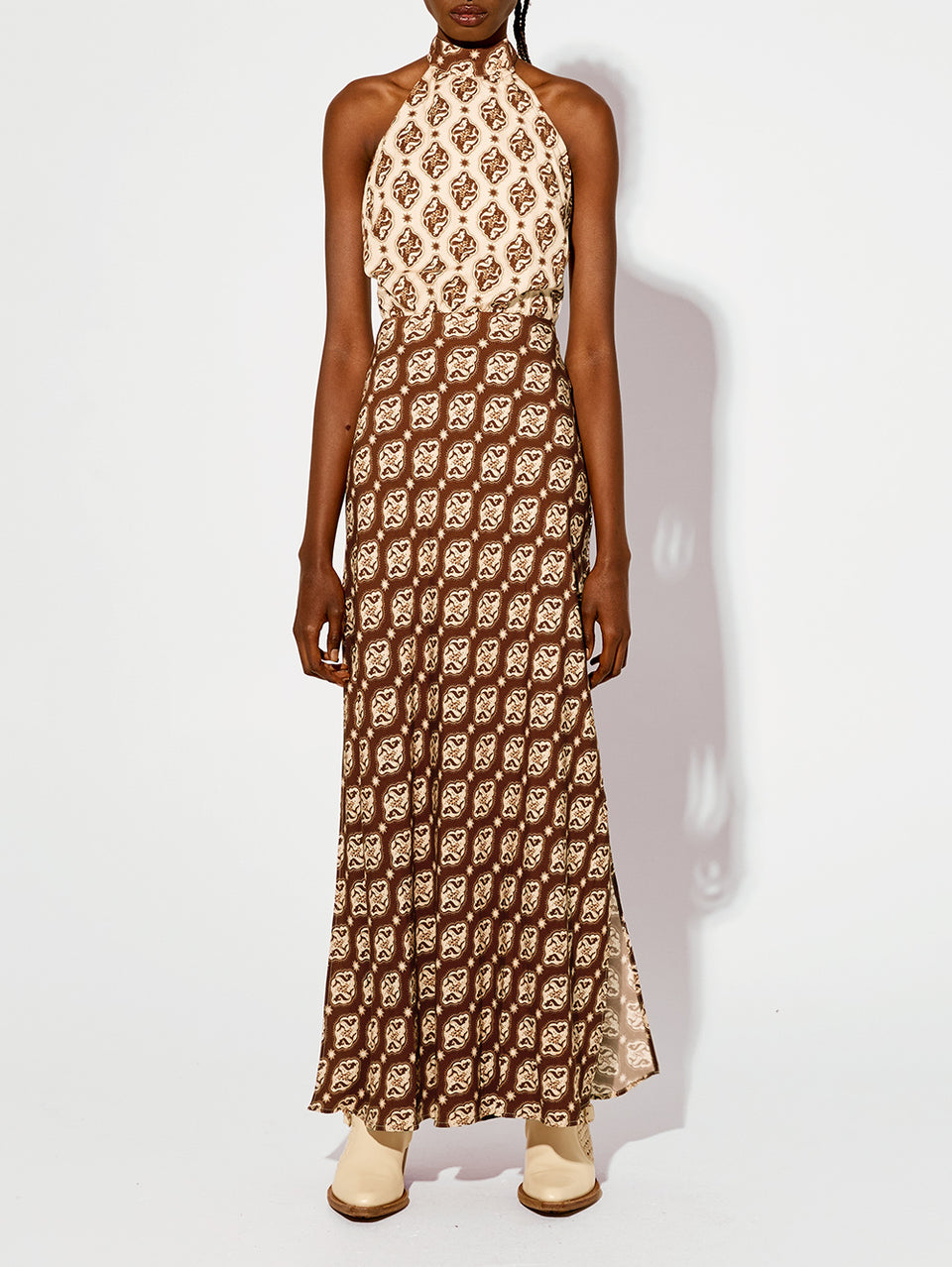 Melody Maxi Dress KIVARI | Model wears brown and cream print halter dress 