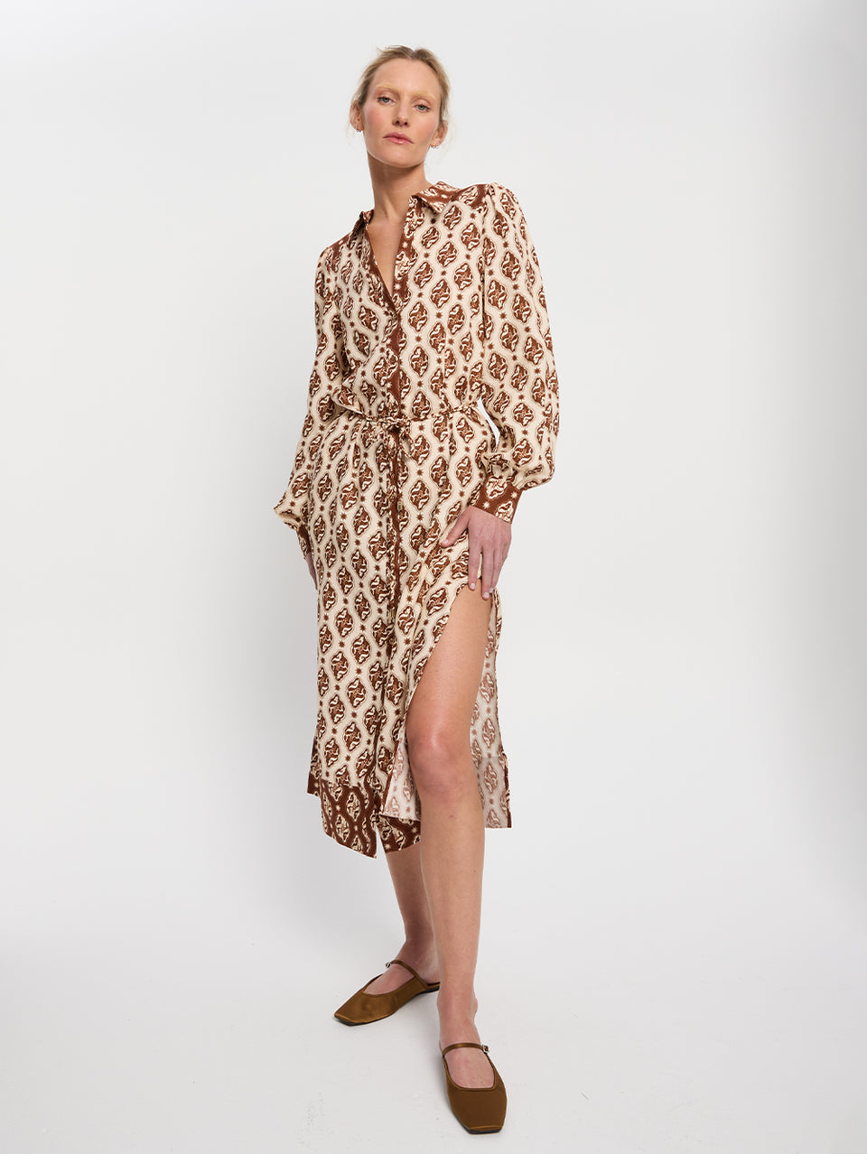 Melody Midi Dress KIVARI | Model wears brown and cream print midi dress