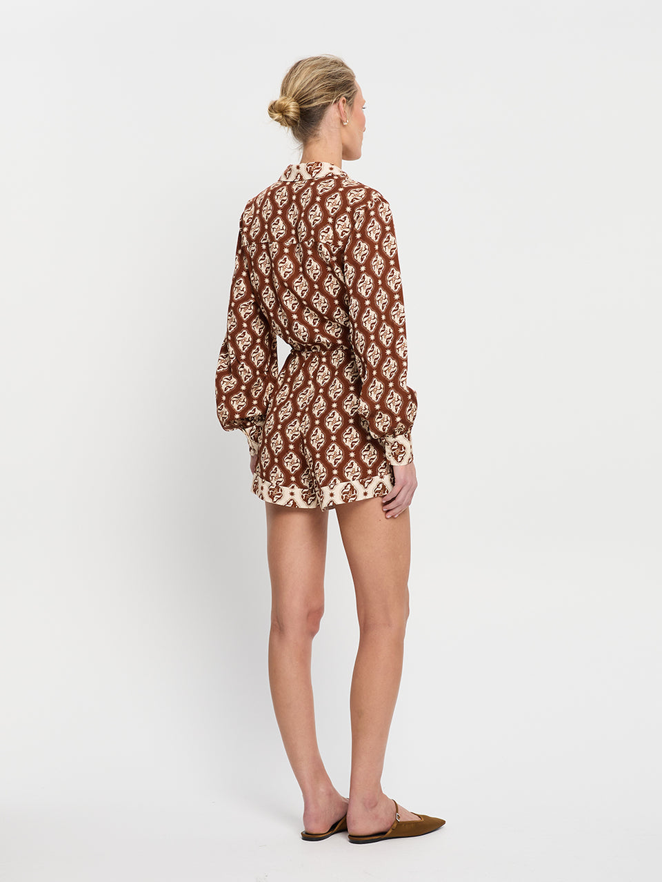 Melody Playsuit KIVARI | Model wears brown and cream print playsuit back view