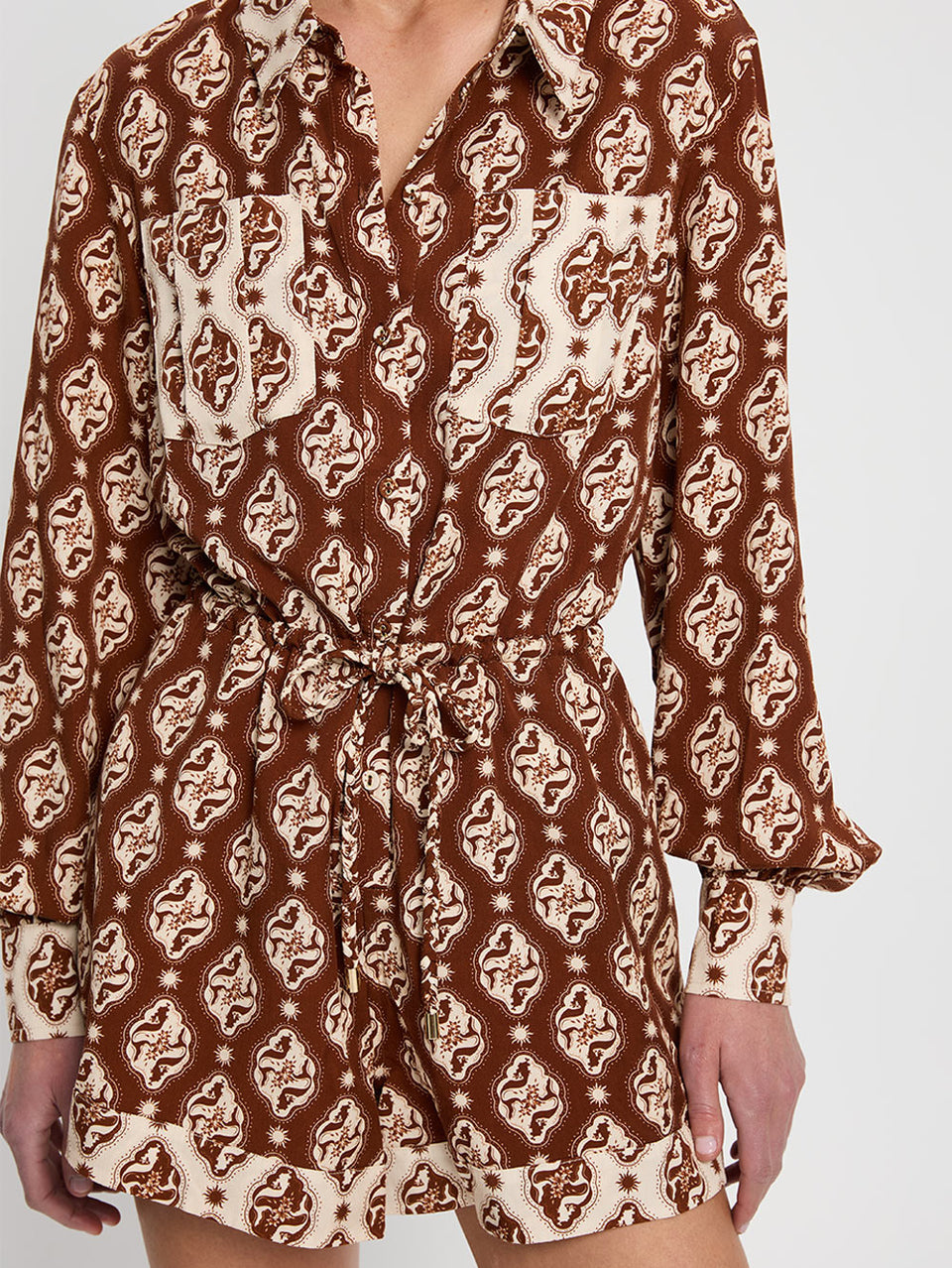 Melody Playsuit KIVARI | Model wears brown and cream print playsuit close up