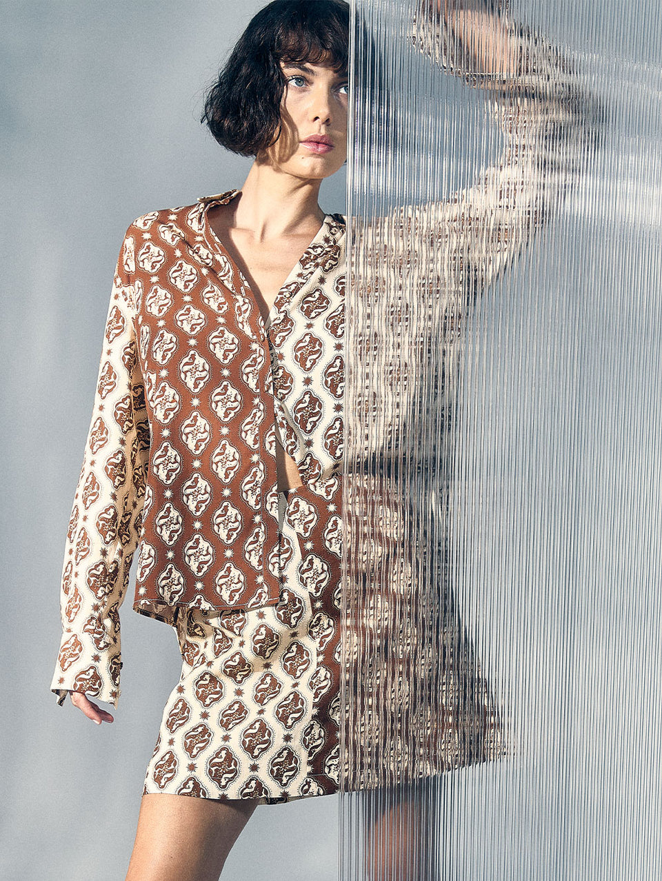 Melody Shirt KIVARI | Model wears brown and cream print shirt campaign