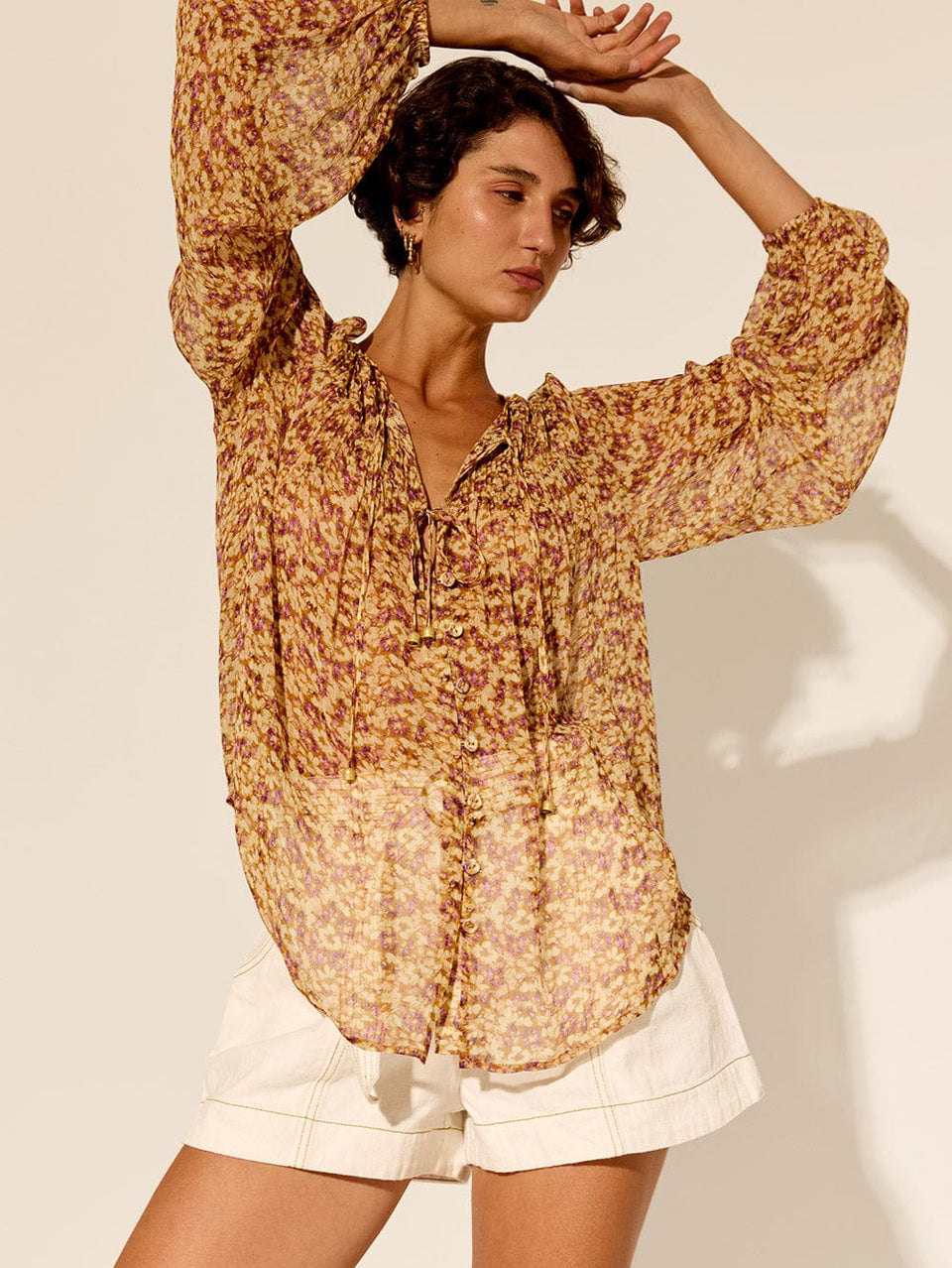 Mia Blouse KIVARI | Model wears orange and purple ditsy printed blouse vibe