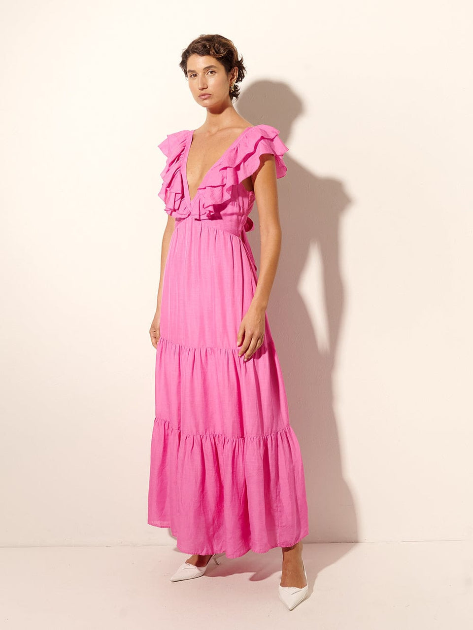 Millie Maxi Dress KIVARI | Model wears pink frilled maxi dress side view