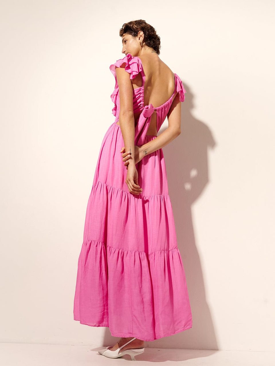 Millie Maxi Dress KIVARI | Model wears pink frilled maxi dress back view