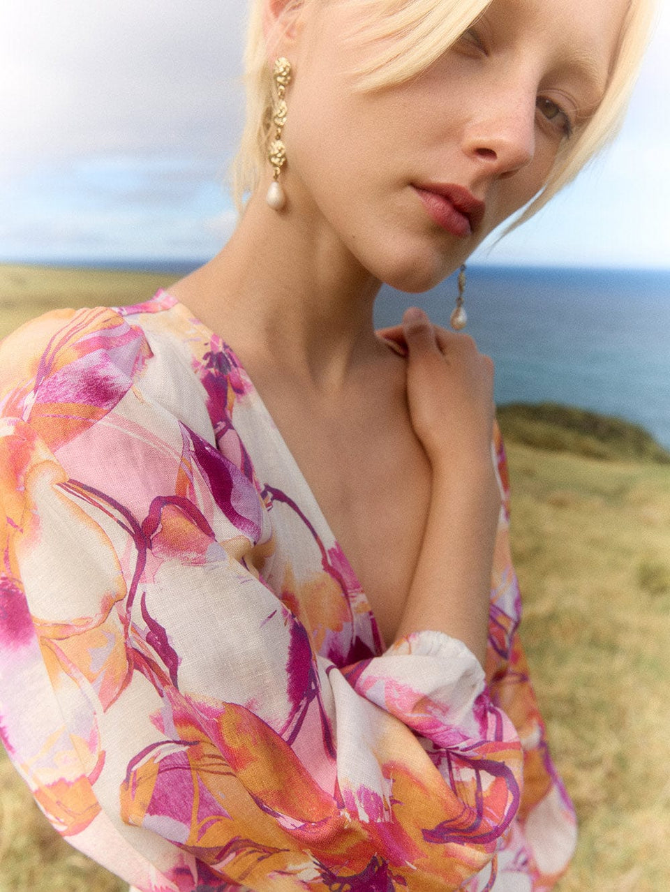 Nadia Maxi Dress KIVARI | Model wears pink and orange watercolour floral maxi dress campaign