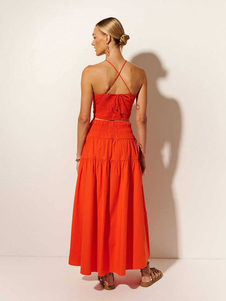 Nora Maxi Skirt | Model wears red maxi skirt back view