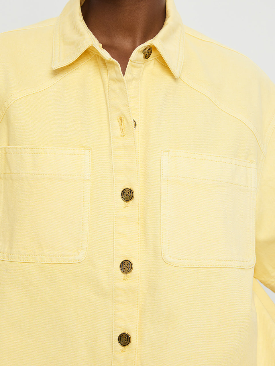 Paloma Shirt Butter | Model wears yellow denim shirt close up