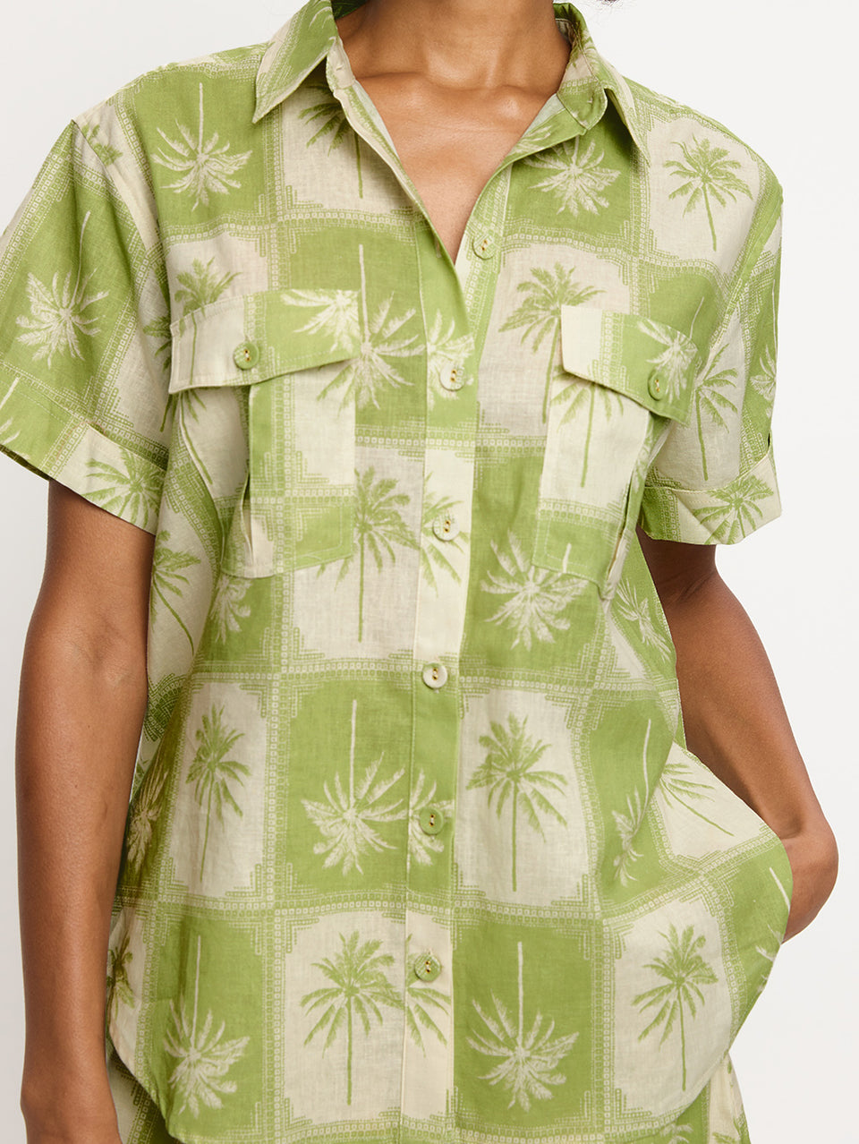 Paradiso Shirt KIVARI | Model wears palm tree printed shirt close up