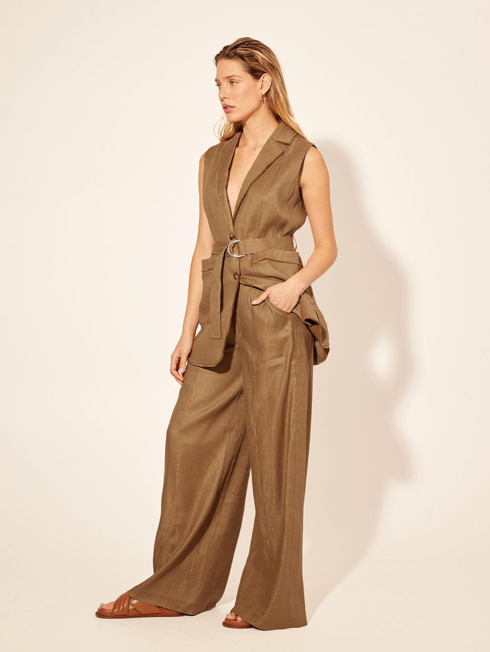 Penelope Pant KIVARI | Model wears brown tailored pant side view