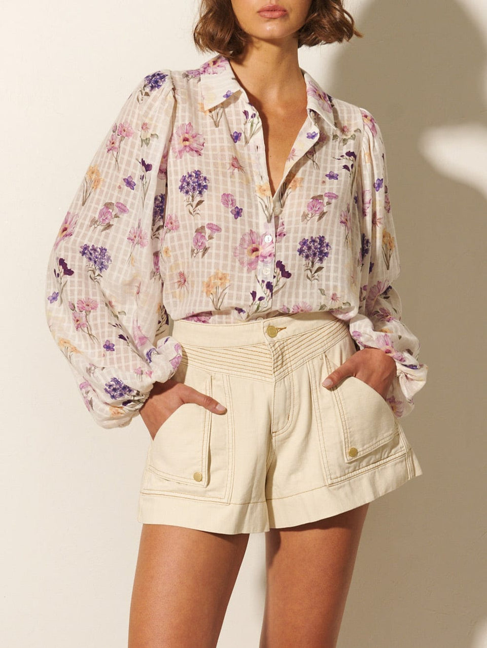 Phoebe Blouse KIVARI | Model wears ivory and purple floral blouse close up
