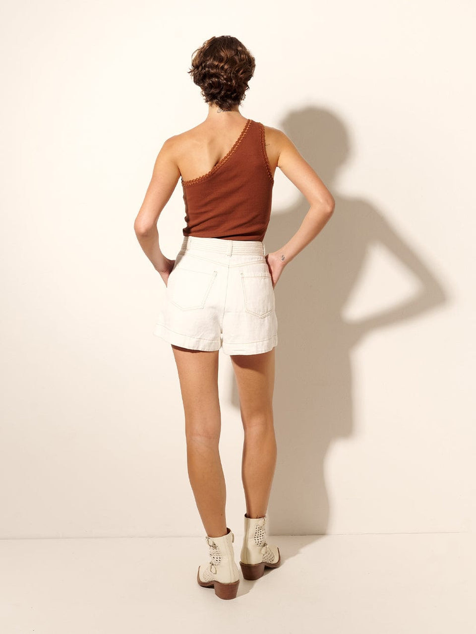 Pippa Denim Short | Model wears cream denim shorts back view