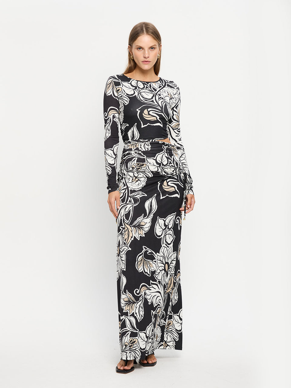 Alma Knit Maxi Dress KIVARI | Model wears black and white floral maxi dress 