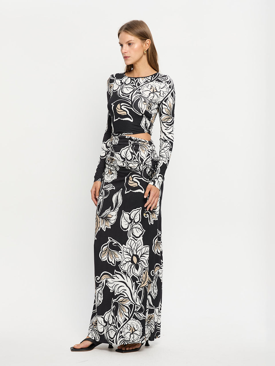 Alma Knit Maxi Dress KIVARI | Model wears black and white floral maxi dress 